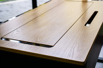 Empty rough wooden table top in the dark room