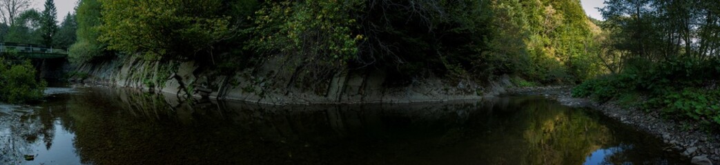 panorama with the river in the mountains on an autumn day