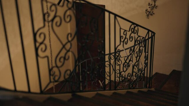 Shot of black iron stairs inside Provencal bastide hotel in France. Luxury hotel and restaurant "La Bastide".