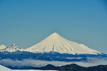 calbuco vulcano Chile winter snow caped panorama ski mountain blue sky