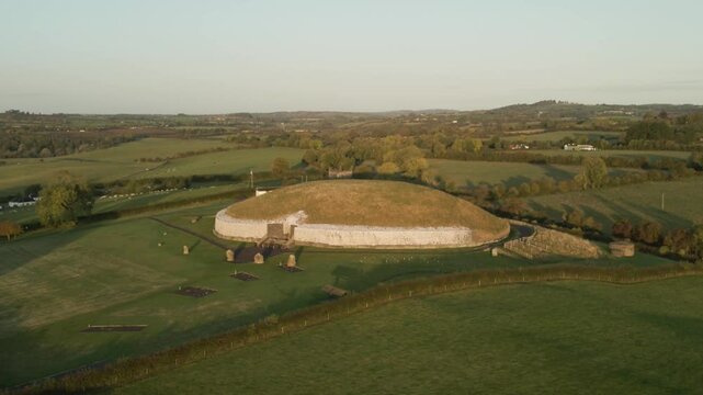 Flying Towards The Newgrange Mound At Sunrise In County Meath, Ireland. - aerial shot