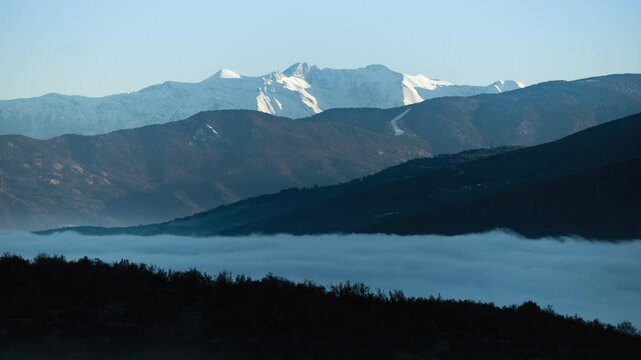 Time lapse Cloud Inversion Over Snowy Peaks Mountain Olympus Greece