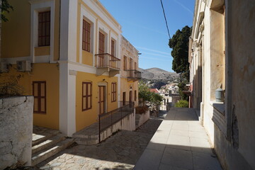 Obraz premium picturesque streets and colorful facades of Symi island