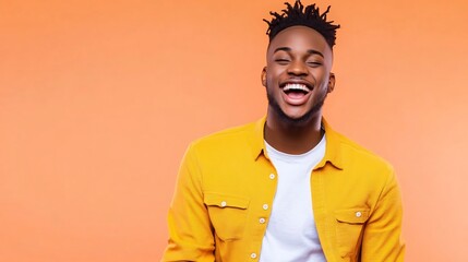 Obraz premium Cheerful and Confident Man in Casual Outfit on Pastel Peach Background