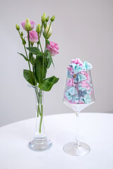 Meringue in a glass. Bouquet of pink flowers. Sweets