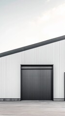 Modern Industrial Building: Sleek lines and minimalist design characterize this contemporary industrial building, showcasing a large dark grey loading door against a clean white facade.