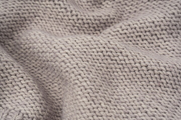 Grey wool sweater texture as a background.