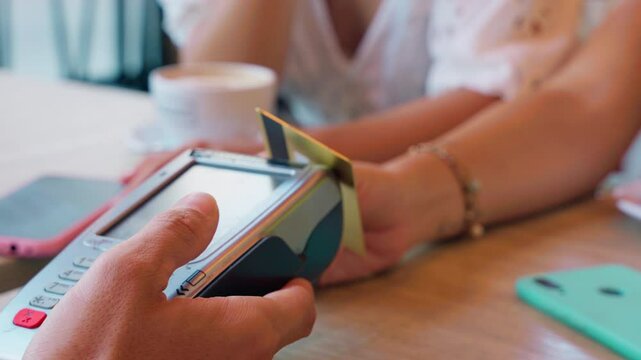 Close-Up of Credit Card Payment at a Cafe