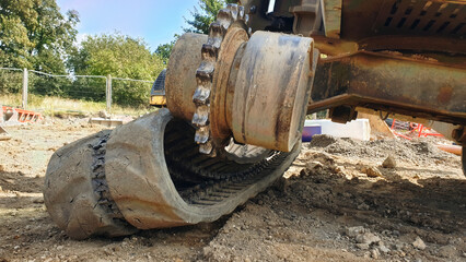 Excavator lost broken track and waiting for repair