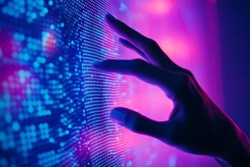 Hand touching a screen with blue and purple background   symbolizing technology and innovation