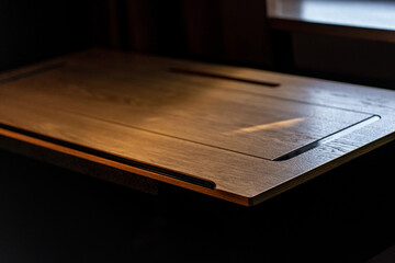 Mobile phone with wireless charger on table. Modern workplace accessory
