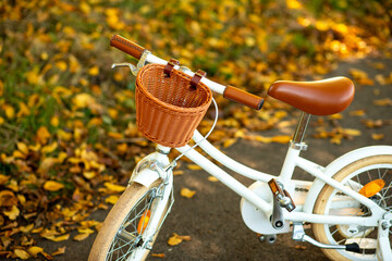 children's modern white bicycle with leather seat in retro style