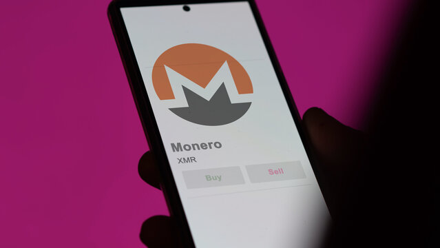 Monero on the screen of an exchange. XMR Monero price stocks, $XMR on a device, close up on logo of XMR 