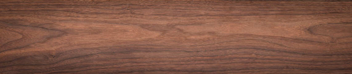Walnut wood texture background. Walnut plank top. Long plank texture background. Panoramic wood plank texture background. Walnut wood plank natural texture. Panoramic background elements.