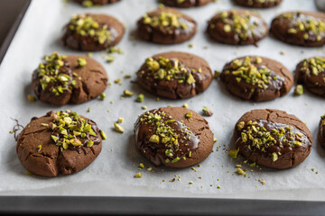 Chocolate Cookies Covered with Chocolate and Sprinkled with Chopped Pistachios – Perfect for Christmas 