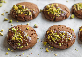 Chocolate Cookies Covered with Chocolate and Sprinkled with Chopped Pistachios – Perfect for Christmas 