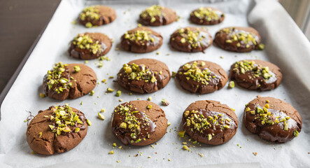 Chocolate Cookies Covered with Chocolate and Sprinkled with Chopped Pistachios – Perfect for Christmas 