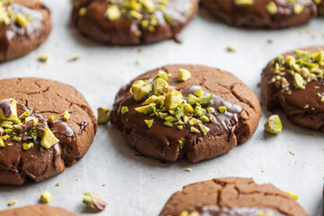 Chocolate Cookies Covered with Chocolate and Sprinkled with Chopped Pistachios – Perfect for Christmas 