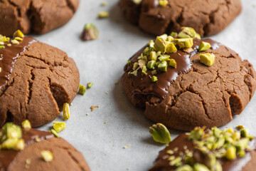 Chocolate Cookies Covered with Chocolate and Sprinkled with Chopped Pistachios – Perfect for Christmas 