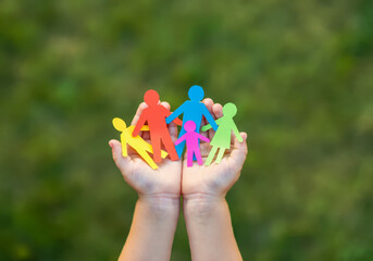 Hands with Paper People in a Circle Highlighting Teamwork, Social Protection, and Peaceful Community Living