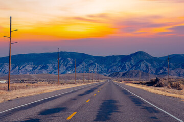 Fototapeta premium road to the mountains, Empty Road Along Countryside Landscape