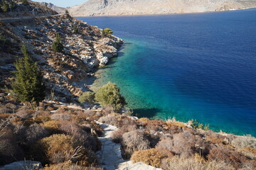 Fototapeta premium turquoise clear water on Symi island shoreline