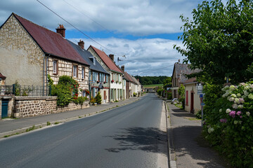 Naklejka premium Quaint village street in France showcasing classic architecture