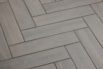 Experience stunning Herringbone Patterned Flooring in soft gray tones that enhance any space