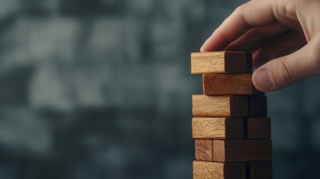 Close-up of hand placing a final block on a financial tower, carefully balancing risk and reward in strategy, Risk reward, financial strategy