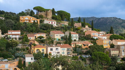 Panoramic view of houses and roofs of medieval village of Bormes-les-Mimosas, in the Var, in...