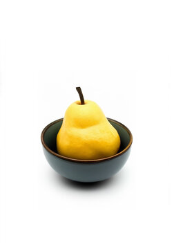 Yellow pear in a bowl; Yellow pear in a deep plate