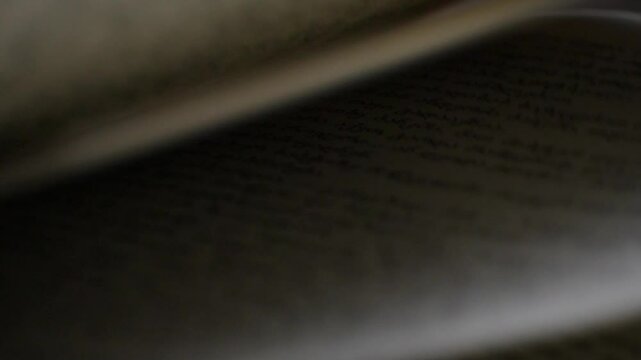 Close-up, slow motion, macro shot of flipping book pages