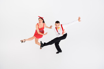 Photo of cheerful couple professional dancers dance in dancehall studio juzz funk isolated on white...