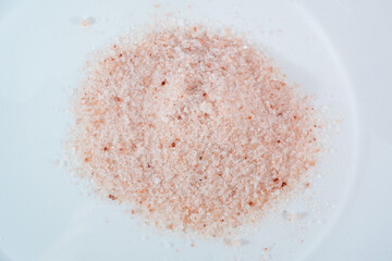 Pink himalayan salt on white background