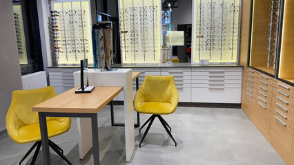Modern eyewear store interior showcasing diverse glasses selection, emphasizing vision care and optical fashion trends