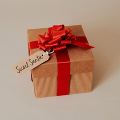 gift box with a tag with the text secret santa