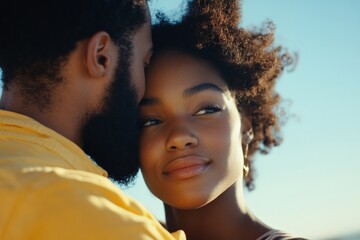 A couple enjoys an intimate moment, embracing each other against a serene outdoor backdrop, showcasing love, connection, and tranquility in their relationship.