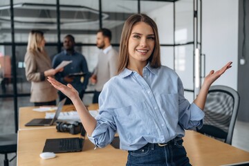 Beautiful woman. Professional workers are in the modern office together