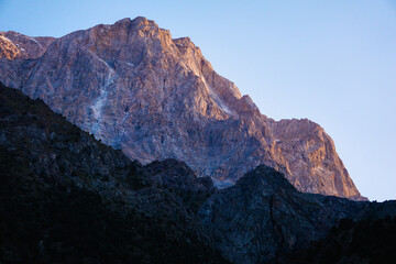 The mountains are illuminated by the sunset light