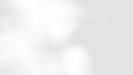 Abstract halftone pattern texture with black dots arranged in a fading gradient across a white background. Vector noise gradient.