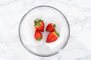 Washed and Dried Strawberries Neatly Stored in a Glass Bowl