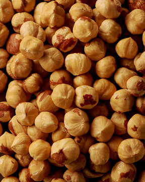 Background of roasted and peeled hazelnut kernels