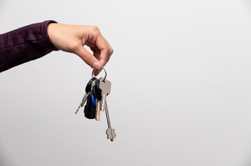 Woman's hand holding a house key
