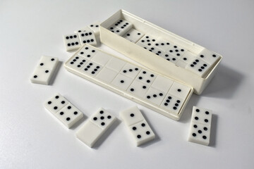 dominoes in box on white backgroundon 