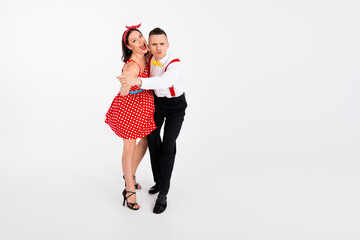 Full size portrait of two young partners dancers perform empty space isolated on white color...
