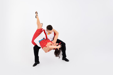 Full size portrait of two young rock and roll dancers empty space isolated on white color background