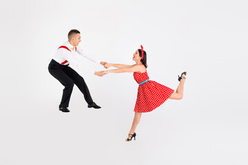 Photo of attractive couple professional dancers choreographers dancing swinging rumba isolated on...