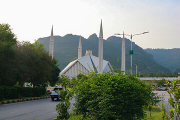 Faisal mosque with Margalla hills in the background. Modern architecture of Faisal mosque surrounded by nature