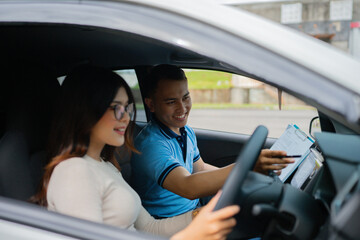 A student is gaining essential driving skills with the valuable guidance of an instructor in a car