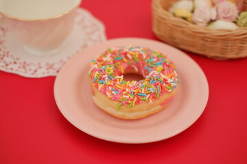 donut and cup on the red table